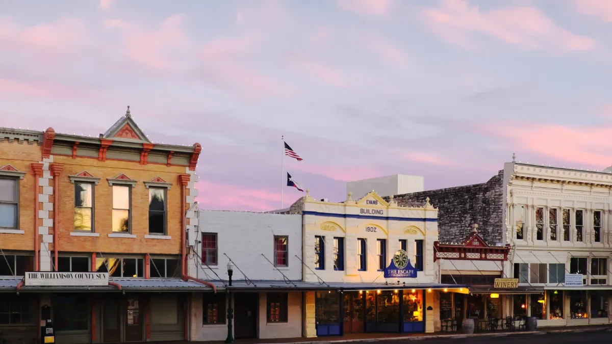 Historic storefronts on the courthouse square in Georgetown, Texas at dusk